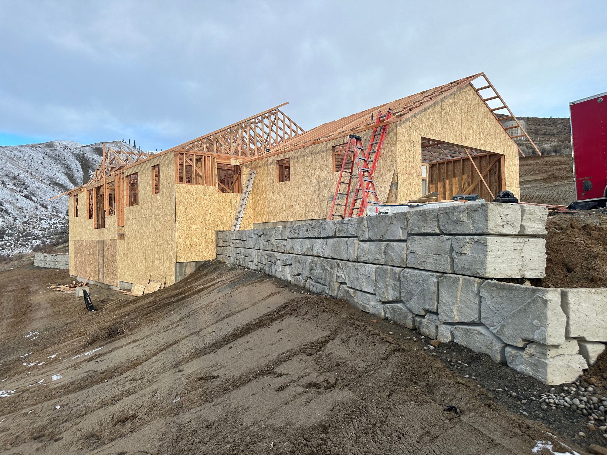 Engineered boulder retaining wall built by Young Bucks in the Wenatchee Valley